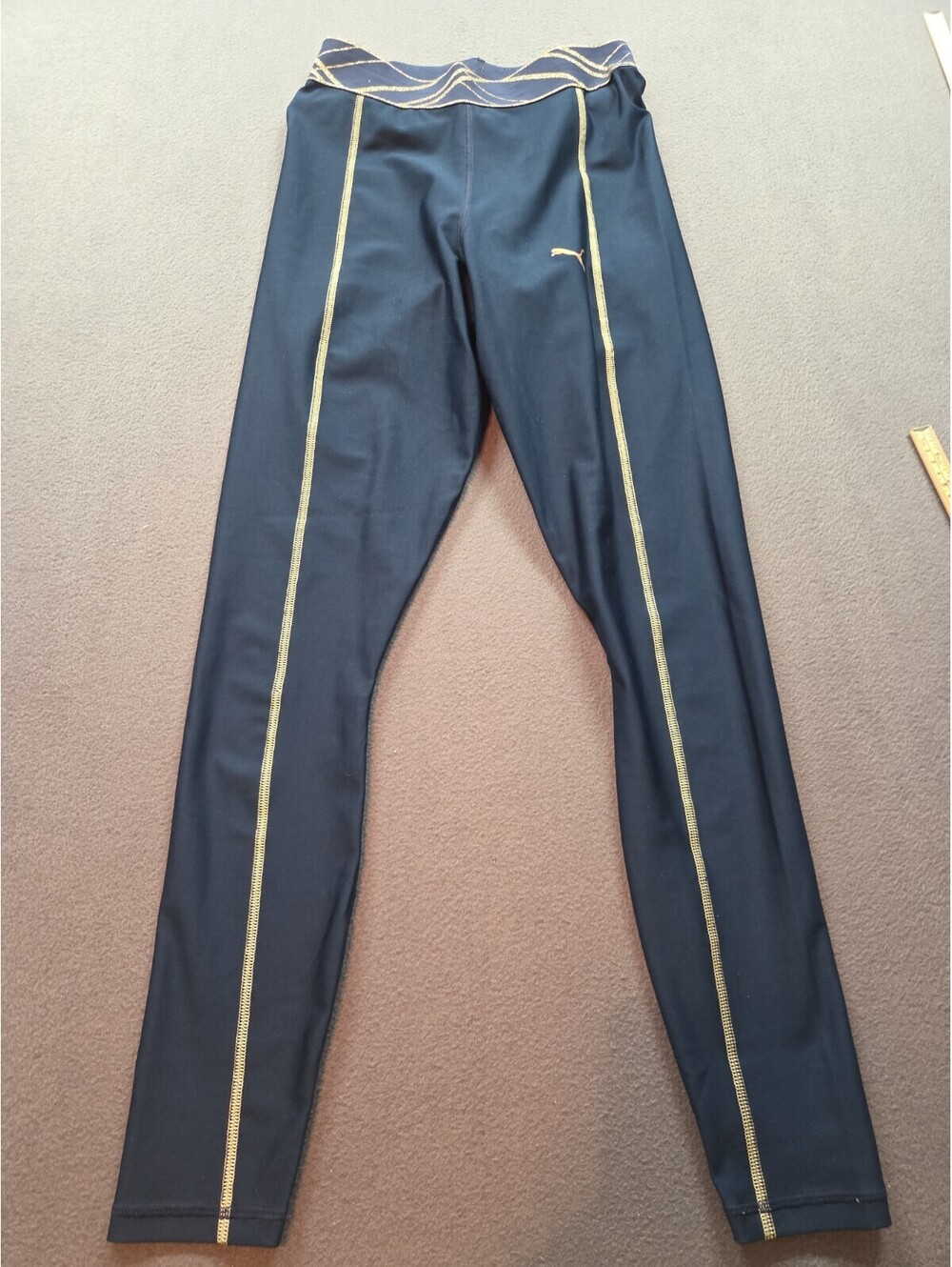 women's blue and gold glitter trimmed leggings by Puma size S